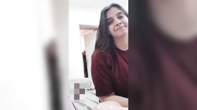 Girlfriend lifting T-shirt and showing fluffy huge boobs